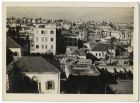 Photograph of a town, taken from a high vantage point, with hills in the distance, location unknown, probably in North Africa, 1940 - 1943