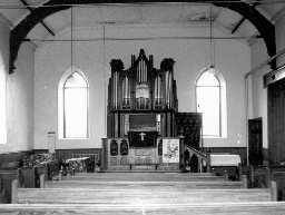 The inrterior of Slaggyford Wesleyan Methodist Church showing dais and organ . Photo by Peter Ryder.
