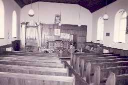 The interior of Allenheads Chapel showing the benches, pulpit, communion rail and organ. Photo Peter Ryder.