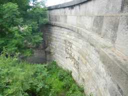 Side of the bridge, showing graffiti 2016