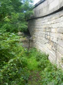 Side of the bridge, showing graffiti 2016