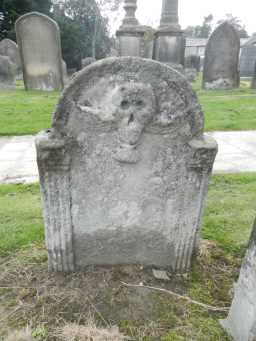 photograph of front of winged skull headstone at St Romald 2016