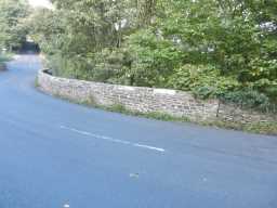 photograph of wall and road leading away from Lune Bridge 2016