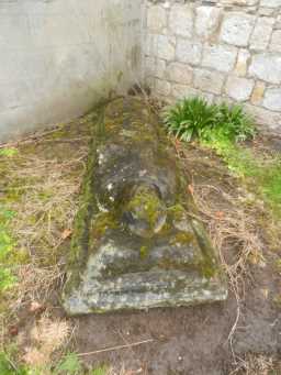 Photograph of back of Reclining Effigy against Church of St James 2016