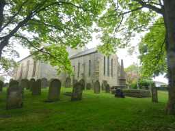 Photograph of graves and St. Margaret of Antioch Church 2016