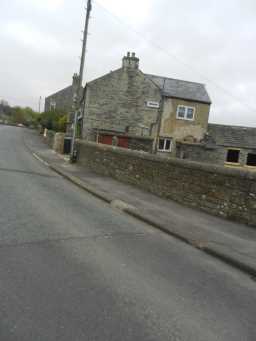 Photograph of road and Bonnymoor & Harthopeburn Cottage 2016