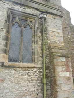 Photograph of square window and pipe at St. Mary's Church 2016