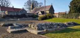 Photograph of Piercebridge Roman fort in the early evening March sunlight, with St. Mary's Church 19-MAR-2022